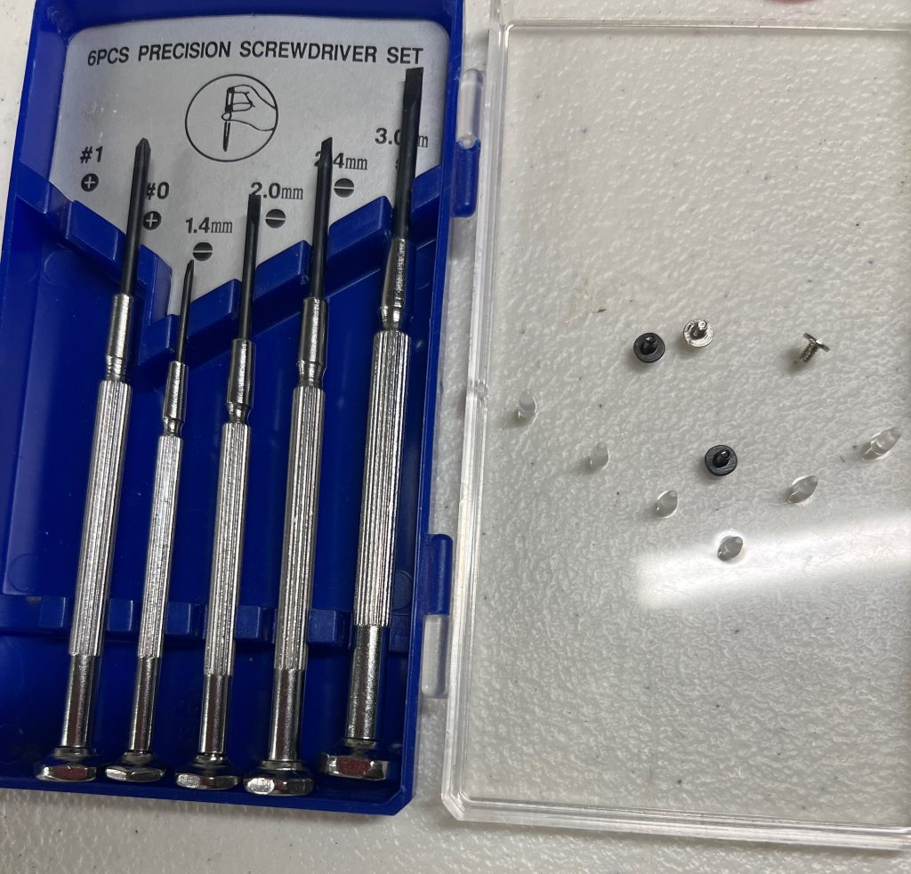 Four screws left over, one each from the top of the posts.