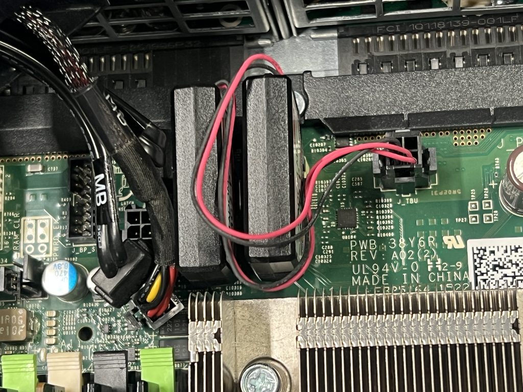 Cables for a built-in 1TB SSD and the CDROM are disconnected, and moved to the left.