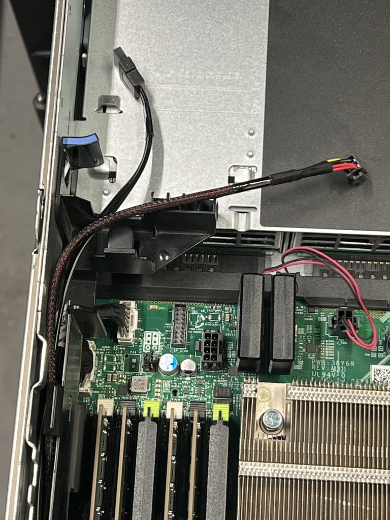 The SATADOMs are in place. Those two cables can't stay there.